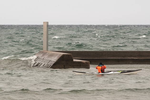January 1, 2021, Toronto, Ontario, Canada: A winter kayaker takes in the the sight of a second mysterious metal monolith off Torontos shoreline New Years Day. The structure was anonymously and strategically placed on the breakwall in the early hours of 2021 in direct line of sight of a first column which appeared nearby 24 hours earlier. Toronto Canada - ZUMAs109 20210101_zaf_s109_012 Copyright: xChristopherxDrostx