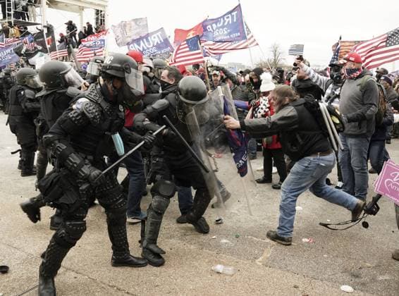Pro-Trump rioters breach the security perimeter and penetrate the U.S. Capitol to protest against the Electoral College vote count that would certify President-elect Joe Biden as the winner in Washington, DC on Wednesday, January 6, 2021. Under federal law, Jan. 6 is the date Electoral College votes determining the next president are counted in a joint session of Congress.  WAP2021010565 KenxCedeno