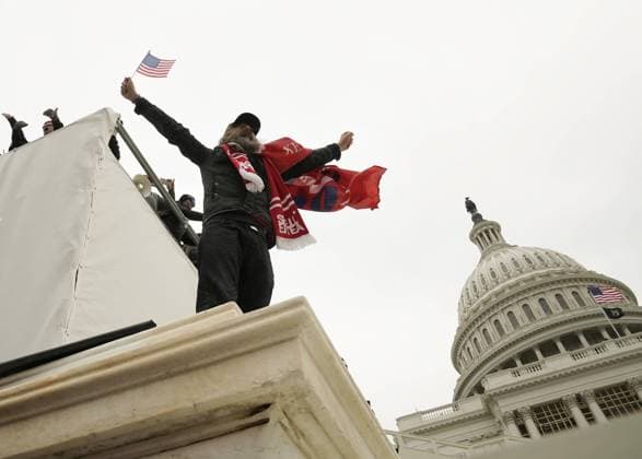 Pro-Trump rioters breach the security perimeter and penetrate the U.S. Capitol to protest against the Electoral College vote count that would certify President-elect Joe Biden as the winner in Washington, DC on Wednesday, January 6, 2021. Under federal law, Jan. 6 is the date Electoral College votes determining the next president are counted in a joint session of Congress.  WAP2021010566 KenxCedeno
