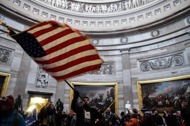 January 6, 2021, Washington, District of Columbia, USA: Pro-Trump mobs storm the US Capitol Wednesday, marauding in hallways, offices and forcing their way into Senate chambers in a stunning attempt to stop the official counting of electoral votes confirming the presidential election the Joe Biden. Washington USA  - ZUMA 20210106_mda_l113_196 Copyright: xMiguelxJuarezxLugox