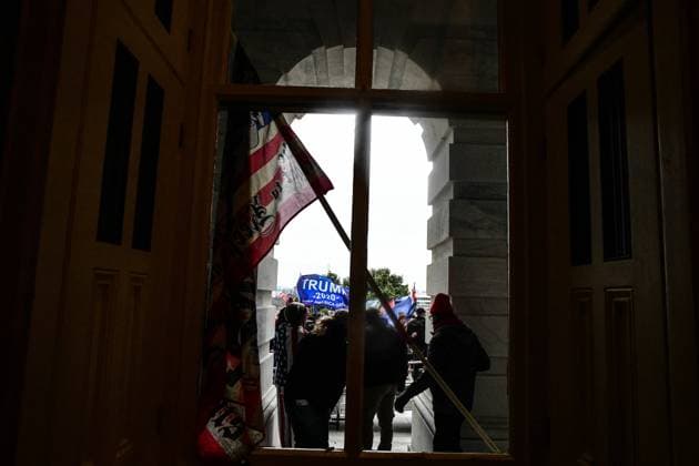 January 6, 2021, Washington, District of Columbia, USA: Pro-Trump mobs storm the US Capitol Wednesday, breachingf police barricades and forcing lawmakers to stop counting electoral votes and take shelter in an attempt to subvert the presidential election. Washington USA  - ZUMA 20210106_mda_l113_205 Copyright: xMiguelxJuarezxLugox