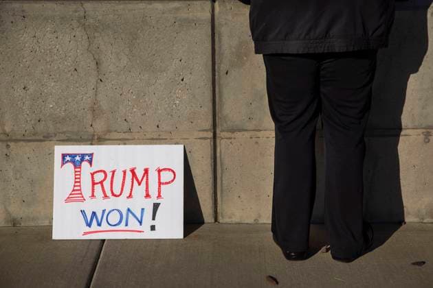 January 6, 2021, Salt Lake City, Utah, USA: A woman stands beside a sign during the Stop The Steal Rally at the Utah State Capitol in Salt Lake City, Utah on January 06, 2021. President Trump supporters gathered in the nation s capital today to protest the ratification of President-elect Joe Biden s Electoral College victory over Trump in the 2020 election. In Washington, DC Trump s supporters stormed a session of Congress held today, January 6, to certify Joe Biden s election win, triggering unprecedented chaos and violence at the heart of American democracy and accusations the president was attempting a coup. Salt Lake City USA - ZUMAc244 20210106_zip_c244_021 Copyright: xDanielxCardex