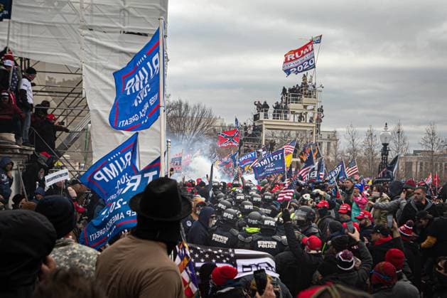 Pro-Trump Supporters Breach The US Capitol Building On January 6, 2021, Pro-Trump supporters and far-right forces flooded Washington DC to protest Trump s election loss. Hundreds breached the U.S. Capitol Building, aproximately 13 were arrested and one protester was killed. Washington DC District of Columbia United States Copyright: MichaelxNigro