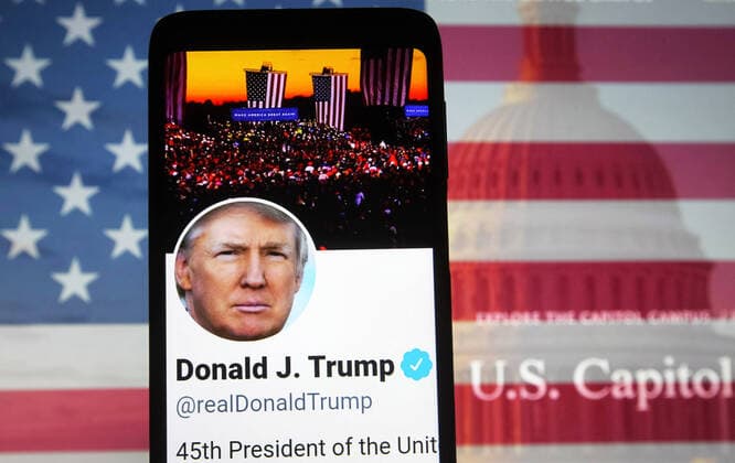 January 7, 2021, Kiev, Kyiv, Ukraine: In this photo illustration, U.S. President Donald Trump Twitter Account is seen displayed on a smartphone screen in front of the U.S. flag and Capitol building during the U.S. Congress session to certify the 2020 Presidential election results. Kiev Ukraine - ZUMAs197 20210107_zab_s197_002 Copyright: xPavloxGoncharx