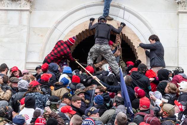 Pro-Trump Riot in Washington DC Rioters clash with police trying to enter Capitol building through the front doors. Rioters broke windows and breached the Capitol building in an attempt to overthrow the results of the 2020 election. Police used buttons and tear gas grenades to eventually disperse the crowd. Rioters used metal bars and tear gas as well against the police. Washington DC District of Columbia United States Copyright: LevxRadin