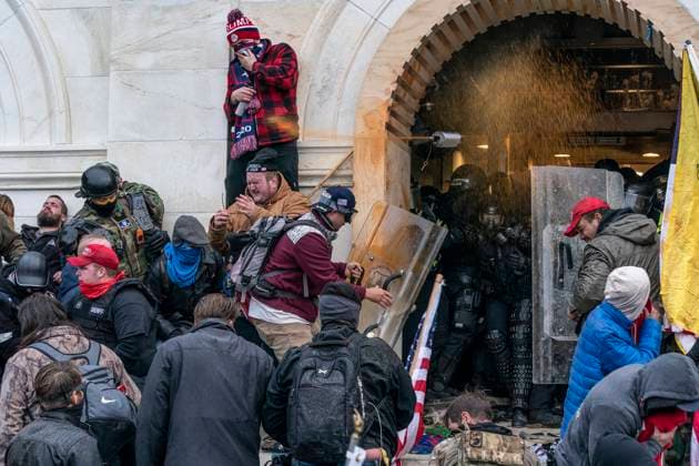 Pro-Trump Riot in Washington DC Police defend Capitol building against Pro-Trump protesters by using papper spray. Illegal invasion of Capitol building produced four death of protesters, 50 police officers were wounded and lots of property damaged. Washington DC District of Columbia United States Copyright: LevxRadin