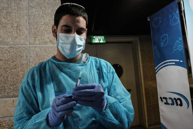 January 14, 2021, Jerusalem, Israel: Nurses administer COVID-19 vaccines at the Pais Arena Sports Complex in Jerusalem, converted into a Coronavirus vaccination center. Criteria is now either health workers, education workers, or the general public 50 years of age and above. The number of Israeli citizens who have received at least one dose of the Pfizer BioNTech vaccine has exceeded 2M as a mass vaccination campaign continues, and so does COVID-19 infection in the general public. Jerusalem Israel - ZUMAa126 20210114_zap_a126_011 Copyright: xNirxAlonx