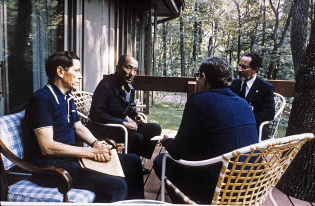 Sep 12, 1978 - Thurmont, Maryland, U.S. - President ANWAR SADAT of Egypt, center left, confers with Foreign Minister MUHAMMAD IBRAHIM KAMAL of Egypt, right, Deputy Premier HASSAN TOHAMI of Egypt, right center, and OSAMA AL BAZ, Ambassador of Egypt to the U.S., left, at Camp David. Thurmont U.S. - ZUMAz03_ 19780912_jes_z03_215 Copyright: xWhitexHousex