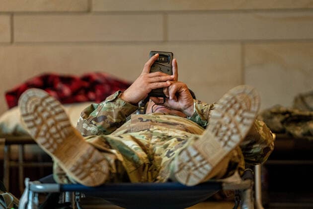 National Guard troops rest up inside the U.S. Capitol ahead of the inauguration for President-elect Joe Biden in Washington, DC on Monday, January 18, 2021. Security is even tighter given the recent events when pro-Trump MAGA mobs breached the security perimeter and penetrated the U.S. Capitol on Jan 6.  WAP20210118530 KenxCedeno