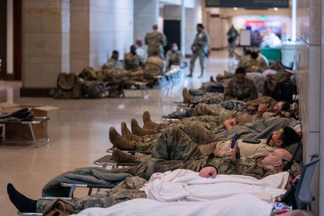 National Guard troops rest up inside the U.S. Capitol ahead of the inauguration for President-elect Joe Biden in Washington, DC on Monday, January 18, 2021. Security is even tighter given the recent events when pro-Trump MAGA mobs breached the security perimeter and penetrated the U.S. Capitol on Jan 6.  WAP20210118531 KenxCedeno