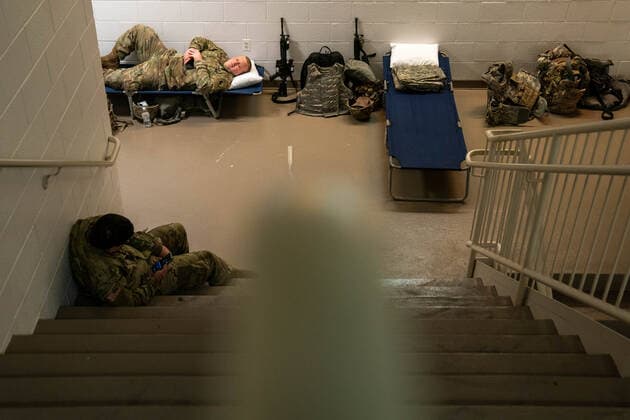 National Guard troops rest up inside the U.S. Capitol ahead of the inauguration for President-elect Joe Biden in Washington, DC on Monday, January 18, 2021. Security is even tighter given the recent events when pro-Trump MAGA mobs breached the security perimeter and penetrated the U.S. Capitol on Jan 6.  WAP20210118523 KenxCedeno