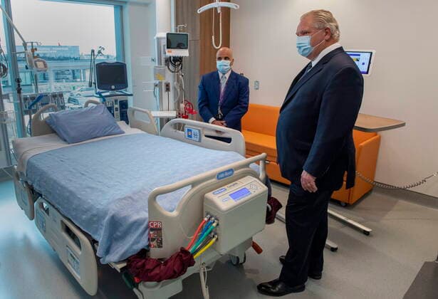 January 18, 2021, Vaughan, on, Canada: Ontario Premier Doug Ford is given a tour of a digital Intensive Care Unit room at Cortellucci Vaughan Hospital by Altaf Stationwala, President and CEO of Mackenzie Health in Vaughan, Ontario on Monday, January 18, 2021. The new hospital is being opened to take patients from other hospitals that are strained by COVID-19. Vaughan Canada  - ZUMAc35_ 20210118_zaf_c35_031 Copyright: xFrankxGunnx