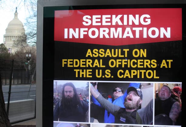 WASHINGTON, D.C., UNITED STATES - JANUARY 18, 2021: An information board shows people who are wanted by the police on suspicion of assaulting federal officers at the US Capitol during riots. The US capital is further tightening security measures ahead of the inauguration of US President-elect Biden scheduled for 20 January. Yegor Aleyev TASS  TS0F48F4