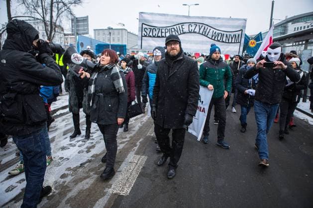 Anticovid March for Freedom, against sanitary segregation and compulsion of vaccinations in Warsaw Justyna Socha, Grzegorz Braun Anticovid March for Freedom, against sanitary segregation and compulsion of vaccinations on January 16, 2021 in Warsaw, Poland. EN_01460773_0049 