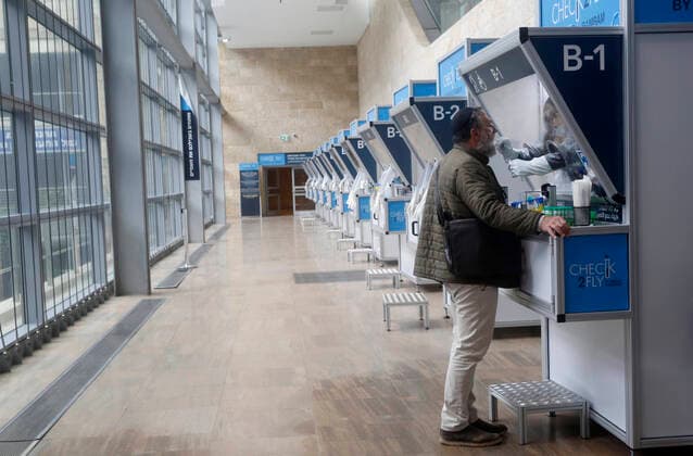 (210120) -- TEL AVIV, Jan. 20, 2021 -- A staff member takes samples from a passenger at a COVID-19 testing booth at Ben Gurion International Airport near Tel Aviv, Israel, Jan. 19, 2021. Israel s cabinet decided on Tuesday to extend by 10 days a weeks-long nationwide lockdown to curb the spread of the COVID-19 pandemic. The ministers voted in favor of extending the tight lockdown until Jan. 31, according to a cabinet statement. The cabinet also decided that travelers entering the country will be required to present a negative coronavirus test taken within 72 hours before their flight. (Photo by Gil Cohen Magen Xinhua) ISRAEL-TEL AVIV-AIRPORT-COVID-19 ShangxHao 