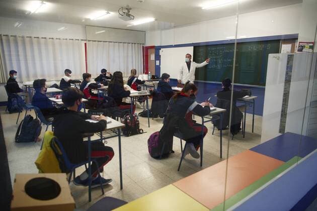 A teacher teaches the students of Arcangel Rafael School on the day of the reopening of the schools after the great snowfall registered by the passage of Filomena , in Aluche, Madrid, (Spain), on January 20, 2021. The Filomena pass caused the closure of the schools on January 11 to guarantee a safe return to the classrooms after the snow and cold storm. The main reasons for the closure were the difficulty in guaranteeing access and transport to the schools, as well as the safety of the schools due to the damage caused by the accumulated snow and ice, and the falling of trees in the infrastructures. 20 JANUARY 2021;PHILOMENA;SCHOOL;REOPENING;SNOW Eduardo Parra LagenciaEP 01 20 2021 Madrid Madrid Spain Copyright: xEduardoxParrax 3524768