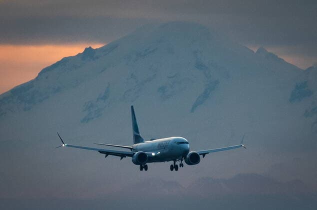 January 21, 2021, Richmond, BC, Canada: Mount Baker in Washington is seen in the distance as a WestJet Airlines Boeing 737 Max aircraft arrives at Vancouver International Airport in Richmond, B.C., on Thursday, January 21, 2021. The flight from Calgary is the first commercial Boeing 737 Max flight in Canada since the aircraft was grounded worldwide in 2019 following two deadly crashes. Transport Canada lifted its grounding order for the Max on Wednesday after approving design changes to the plane and requiring pilots to undergo additional training. Richmond Canada  - ZUMAc35_ 20210121_zaf_c35_014 Copyright: xDarrylxDyckx