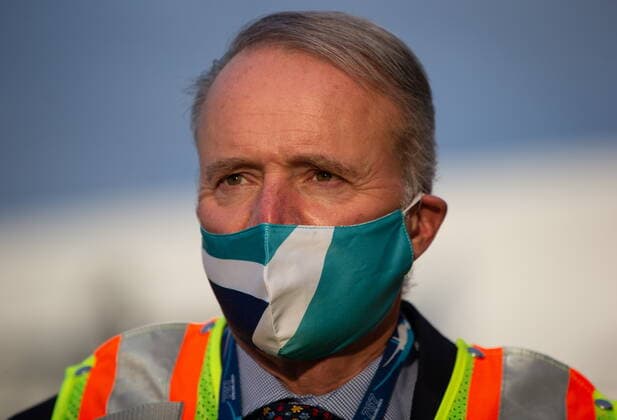 January 21, 2021, Richmond, BC, Canada: WestJet Airlines President and CEO Edward Sims wears a company branded face mask after arriving at Vancouver International Airport on one of the company s Boeing 737 Max aircraft, in Richmond, B.C., on Thursday, January 21, 2021. The flight from Calgary was the first commercial Boeing 737 Max flight in Canada since the aircraft was grounded worldwide in 2019 following two deadly crashes. Transport Canada lifted its grounding order for the Max on Wednesday after approving design changes to the plane and requiring pilots to undergo additional training. Richmond Canada  - ZUMAc35_ 20210121_zaf_c35_032 Copyright: xDarrylxDyckx