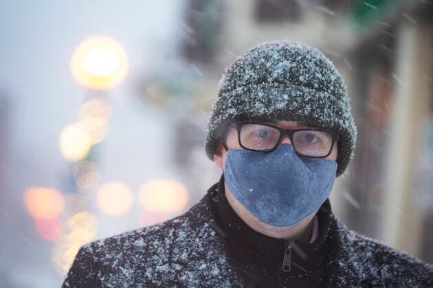 January 21, 2021, St. John S, NL, Canada: Chris Jackson walks along Water Stret in St. JohnÃ¢â‚¬â ¢s NL on Thursday, January 21, 2021 as the first major snow storm of the winter starts to ramp up. St. John S Canada  - ZUMAc35_ 20210121_zaf_c35_074 Copyright: xPaulxDalyx