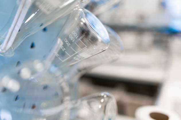 Closeup of empty glass flasks with measuring marks arranged in modern scientific laboratory, Model released Copyright: xCarlosxPintaux MR
