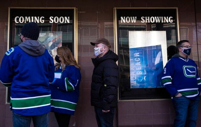 January 23, 2021, Vancouver, BC, Canada: Canucks fans line up outside the Rio Theatre in Vancouver, Saturday, Jan. 23, 2021. The independent movie theatre, which has been closed due to provincial public health restrictions, is now open as a sports bar. Vancouver Canada  - ZUMAc35_ 20210123_zaf_c35_056 Copyright: xMarissaxTielx