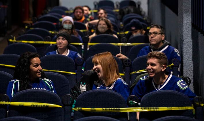 January 23, 2021, Vancouver, BC, Canada: Canucks fans share a laugh as they watch the NHL game between the Vancouver Canucks and the Montreal Canadiens at the Rio Theatre in Vancouver, Saturday, Jan. 23, 2021. The independent movie theatre, which has been closed due to provincial public health restrictions, is now open as a sports bar. Vancouver Canada  - ZUMAc35_ 20210123_zaf_c35_057 Copyright: xMarissaxTielx