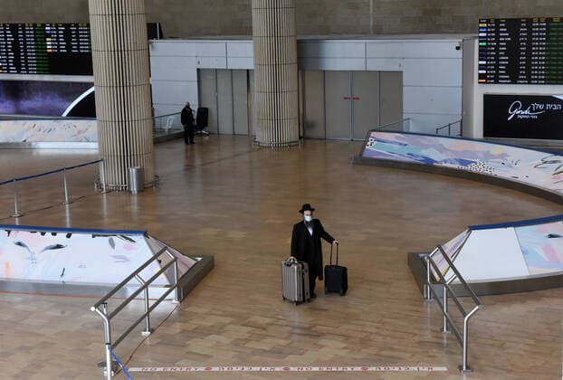 An Ultra-Orthodox man arrives in Israel s Ben Gurion Airport in Lod, near Tel Aviv, on Sunday, January 24, 2021.  JER2021012419 DEBBIExHILL