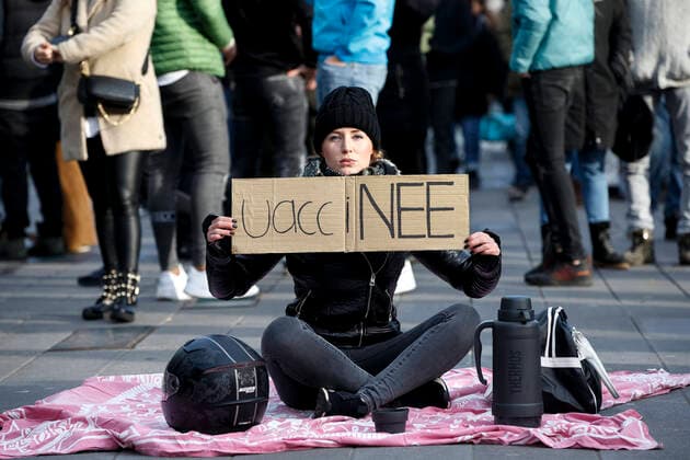 EIDHOVEN, 24-01-2021, 18 Septemberplein, Dutch News, Protests during the dutch lockdown in Eindhoven. Girl during the protest with the word VACCINEE. See says no to vaccines. Protests in Eindhoven  x10564027x Copyright: