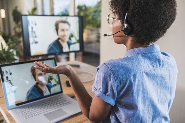 Woman having video conference with man via laptop at home model released Symbolfoto property released UUF22486