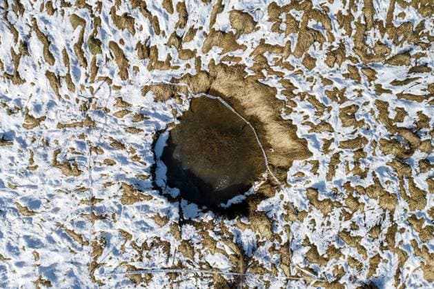 (210128) -- MECENCANI (CROATIA), Jan. 28, 2021 -- Aerial photo taken on Jan. 28, 2021 shows a sinkhole in Mecencani, Croatia. 51 sinkholes have appeared since a 6.4-magnitude earthquake hit central Croatia in late December of 2020. ( Pixsell via Xinhua) CROATIA-MECENCANI-SINKHOLES IgorxKralj 