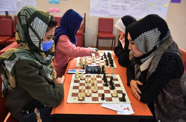 (210129) -- MAZAR-E-SHARIF, Jan. 29, 2021 -- Girls take part in a chess competition organized by Zahra Ebrahimi in Mazar-e-Sharif, capital of northern Balkh province, Afghanistan, Jan. 20, 2021. The COVID-19 related quarantines have not restricted the life of Zahra Ebrahimi in Afghanistan s northern Mazar-e-Sharif city, as she beat her isolated quarantine life and encouraged girls to learn chess in the relatively peaceful city in Afghanistan. TO GO WITH Feature: Chess playing gets popularity among women during COVID-19 in Afghanistan (Photo by Xinhua) AFGHANISTAN-BALKH-CHESS PLAYING KawaxBasharat 