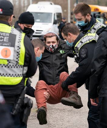 January 29, 2021, Vancouver, BC, Canada: Members of the Extinction Rebellion get arrested after blocking the entrance to the Port of Vancouver, Friday, January 29, 2021. The protesters planned the march and blockade as a part of their anti-pipeline campaign. Vancouver Canada  - ZUMAc35_ 20210129_zaf_c35_067 Copyright: xJonathanxHaywardx