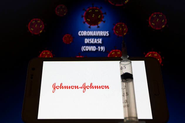 January 30, 2021, Asuncion, Paraguay: Illustration photo of logo of Johnson & Johnson seen displayed on a smartphone behind a syringe with needle backdropped by visual representation of virus and the words coronavirus disease (COVID-19). Johnson & Johnson announced on Jan 29 their single-shot Janssen COVID-19 vaccine candidate met primary endpoints in interim analysis of its Phase 3 ENSEMBLE clinical trial. Asuncion Paraguay - ZUMAc217 20210130_zip_c217_003 Copyright: xAndrexM.xChangx