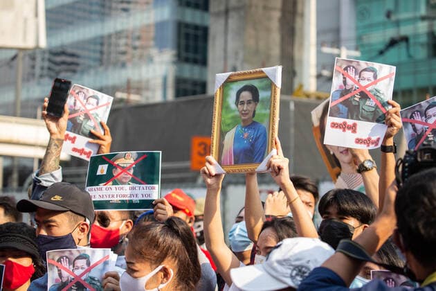 February 1, 2021, Bangkok, Thailand: Demonstrators hold a portrait of Aung San Suu Kyi and Commander in Chief Senior General Min Aung Hlaing marked with a red cross during a protest outside the Embassy of Myanmar in Bangkok. Burmese demonstrators gathered in front of the Myanmar Embassy in Bangkok on the day Myanmar s military detained State Counsellor of Myanmar Aung San Suu Kyi and declared a state of emergency while seizing the power in the country for a year after losing the election against the National League for Democracy Bangkok Thailand - ZUMAs197 20210201_zaa_s197_045 Copyright: xGuillaumexPayenx