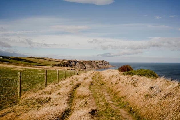 Walking path between Whitby and Robinshood Bay with ocean in the Robin Hood s Bay, England, United Kingdom CR_ISKO210106A-263572-01