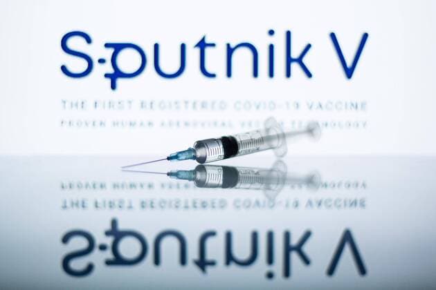 February 2, 2021, Spain: In this photo illustration a medical syringe seen displayed in front of the Sputnik V logo. Spain - ZUMAs197 20210202_zab_s197_055 Copyright: xThiagoxPrudenciox