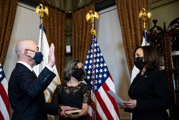 U.S. Vice President Kamala Harris swears in Alejandro Mayorkas to the Secretary of the U.S. Department of Homeland Security (DHS), as his wife Tanya holds a Union Prayer Book during a ceremony in Washington, D.C., on Tuesday, February 2, 2021. A Cuban-American and a former Obama administration official, Mayorkas has served as both the department s deputy secretary and as director of the U.S. Citizenship and Immigration Services.  WAXP20200202154 AlxDrago