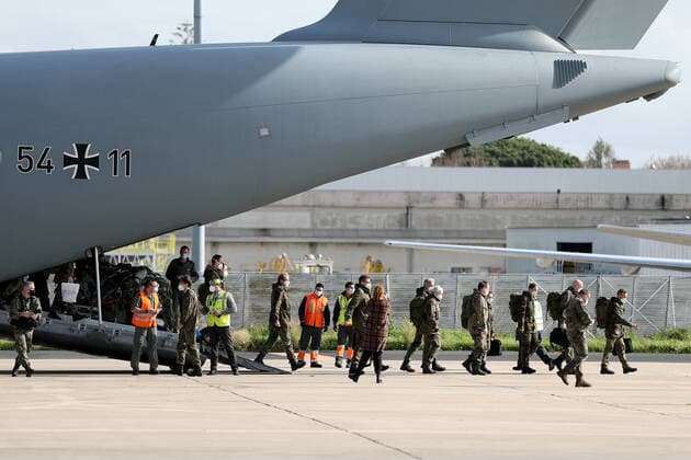 (210203) -- LISBON, Feb. 3, 2021 -- German army medical experts disembark at Figo Maduro military airbase in Lisbon, Portugal, on Feb. 3, 2021. Based on a bilateral agreement, a team of German army medical experts arrived in Portugal on Wednesday to assist the country in its fight against the COVID-19 pandemic. (Photo by Xinhua) PORTUGAL-LISBON-COVID-19-GERMANY-ARMY MEDICS-ARRIVING PedroxFiuza