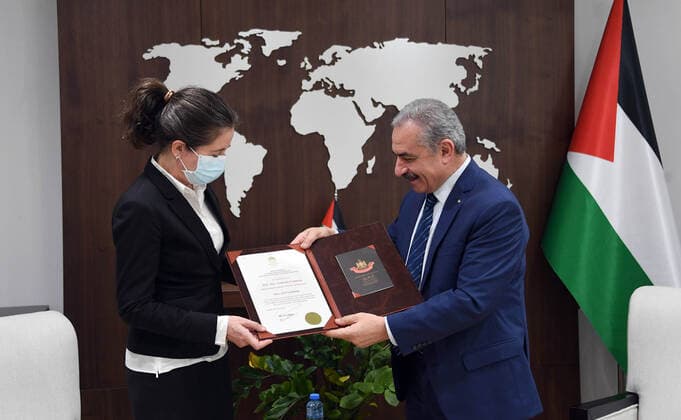 February 4, 2021, Ramallah, West Bank, Palestinian Territory: Palestinian Prime Minister Mohammad Ishtayeh, awards the representative of Denmark to the State of Palestine, Natalia Feinberg and the Order of the Star of Jerusalem, in the West Bank city of Ramallah, on February 4, 2021 Ramallah Palestinian Territory - ZUMAap3_ 20210204_zaf_ap3_171 Copyright: xPrimexMinisterxOfficex