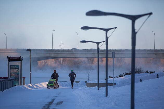 February 5, 2021, Saskatoon, SK, Canada: Pedestrians walk by River Landing beside the South Saskatchewan River during an extreme cold warning in Saskatoon, Sask. on Friday, February 5, 2021. Saskatoon Canada  - ZUMAc35_ 20210205_zaf_c35_008 Copyright: xKaylexNeisx