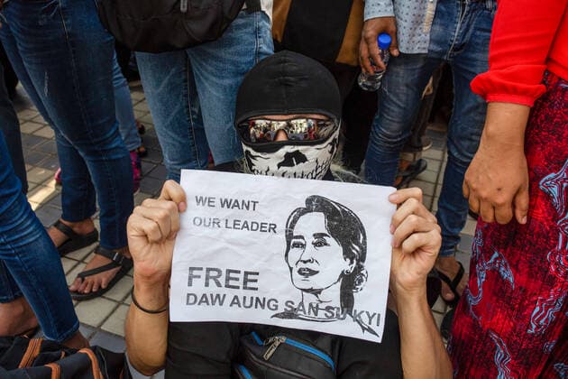 February 7, 2021, Yangon, Myanmar: A protester holds a placard saying Free Aung San Suu Kyi during a demonstration against the military coup..A massive crowd took to the streets of Yangon for the second day of protest against the coup and demanded the release of Aung San Suu Kyi as the government cut off the internet. Myanmar s military detained State Counsellor of Myanmar Aung San Suu Kyi on February 01, 2021 and declared a state of emergency while seizing the power in the country for a year after losing the election against the National League for Democracy Yangon Myanmar - ZUMAs197 20210207_zaa_s197_012 Copyright: xAungxKyawxHtetx