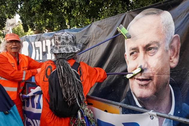 February 8, 2021, Jerusalem, Israel: Crime Minister anti Netanyahu activists lay a red carpet and conduct a mock cleanup operation to Ã¢â‚¬Ëœclean up corruptionÃ¢â‚¬â ¢ and demand PMÃ¢â‚¬â ¢s resignation at the Prime MinisterÃ¢â‚¬â ¢s Residence in Jerusalem. NetanyahuÃ¢â‚¬â ¢s trial begins later today with a hearing he is required to attend at the Jerusalem District Court focusing on his response to the criminal indictment against him. IsraelÃ¢â‚¬â ¢s first serving prime minister to go on criminal trial faces charges of bribery, fraud and breach of trust ahead of 23rd March, 2021 elections. Jerusalem Israel - ZUMAa126 20210208_zap_a126_001 Copyright: xNirxAlonx