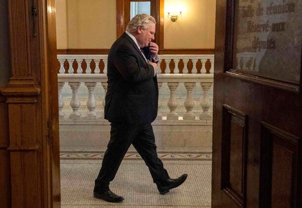 February 8, 2021, Toronto, on, Canada: Ontario Premier Doug Ford walks past an open door as he arrives for the daily briefing in Toronto on Monday, February 8, 2021. Toronto Canada  - ZUMAc35_ 20210208_zaf_c35_017 Copyright: xFrankxGunnx