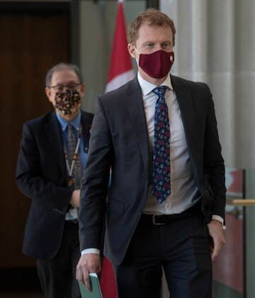 February 10, 2021, Ottawa, on, Canada: Indigenous Services Minister Marc Miller and Chie?f Medical Officer of Public Health Tom Wong make their way to a news conference, Wednesday, February 10, 2021 in Ottawa. Ottawa Canada  - ZUMAc35_ 20210210_zaf_c35_008 Copyright: xAdrianxWyldx