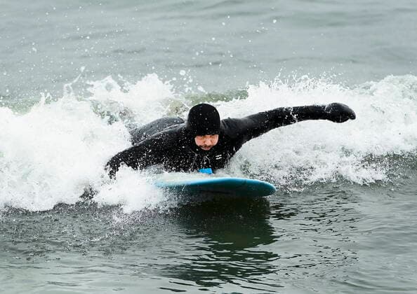 February 12, 2021, Toronto, on, Canada: A man surfs in the frigid ice cold waters of Lake Ontario during the COVID-19 pandemic in Toronto on Friday, February 12, 2021. Toronto Canada  - ZUMAc35_ 20210212_zaf_c35_026 Copyright: xNathanxDenettex