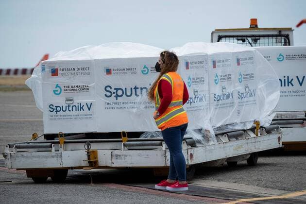 Airport personnel unload the boxes with the Sputnik V vaccines at the Maiquetia International Airport, near Caracas, Venezuela, 13 February 2021. A first batch of the Russian Sputnik V vaccine against covid-19 arrived this Saturday at the Maiquetía International Airport, which serves Caracas, on a plane from Moscow of the Venezuelan state airline Conviasa, as part of the contract established between Venezuela and Russia for ten million doses. The first Sputnik V vaccines arrive in Venezuelan territory !ACHTUNG: NUR REDAKTIONELLE NUTZUNG!  Copyright: xRAYNERxPEÑAxRx AME5600 20210213-637488490548384249