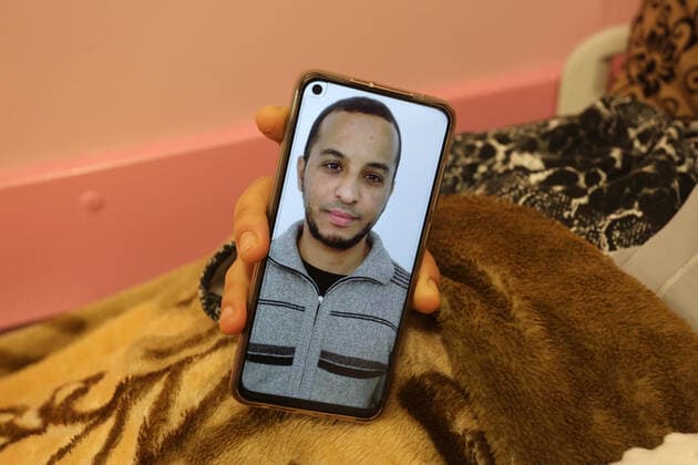 February 18, 2021, khan Younis, Gaza Strip, Palestinian Territory: The wife of the Palestinian prisoner Mohammad al-Qudra displays her husband s picture, who is imprisoned in Israeli prisons, on the mobile phone, at Nasser Medical Complex in khan Younis in the southern of Gaza strip on February 18, 2021. Since 2004, Palestinian security prisoners, who are denied conjugal visitations by their wives, have tried to smuggle their sperm out of Israeli prisons, so that their wives can be inseminated in fertility clinics in the West Bank and Ghazza, and bear them children khan Younis Palestinian Territory - ZUMAap3_ 20210218_zaf_ap3_187 Copyright: xAshrafxAmrax