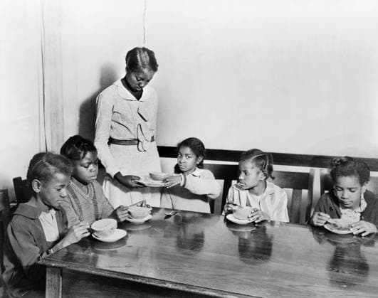 Grapefruit for Drought Beneficiaries, supplied by the American Red Cross, being served to Five Children in School, Mound Bayou, Mississippi, USA, Lewis Wickes Hine, American National Red Cross Collection, 1930  Copyright: xCircaxImagesx ghi-circa09165