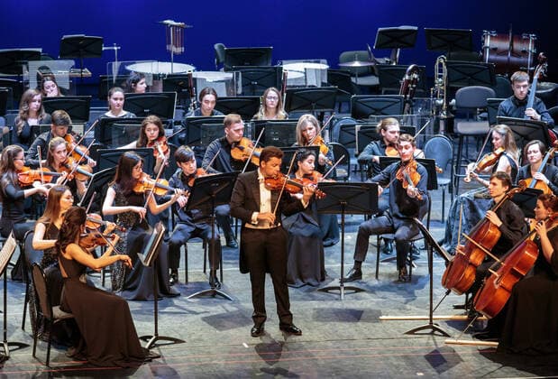 IRKUTSK, RUSSIA - FEBRUARY 19, 2021: Austrian violinist Julian Rachlin (C) performs during the opening of the Stars on Baikal International Music Festival at Zagursky Music Theatre. The festival is the first large-scale cultural event in the region since the lifting of COVID-19 restrictions. Alexei Kushnirenko TASS  TS0F7447