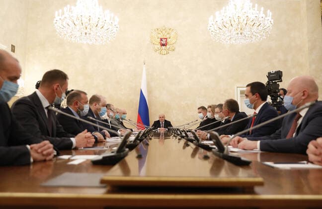 MOSCOW, RUSSIA - FEBRUARY 20, 2021: Russia s Prime Minister Mikhail Mishustin (C) during a meeting on circulation of vaccines at the House of the Russian Government. Dmitry Astakhov POOL TASS  TS0F7497